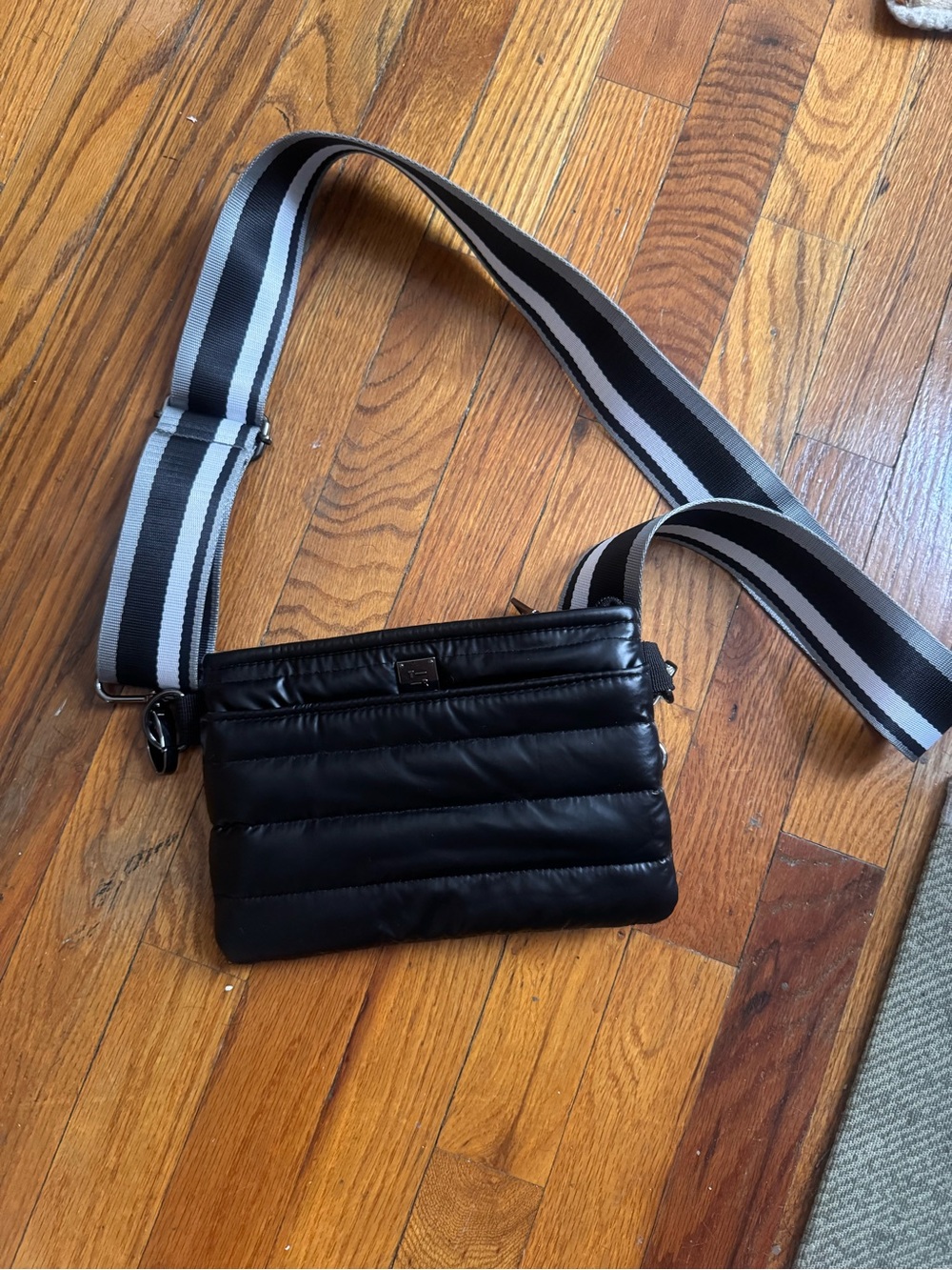 THINK ROYLN Black Quilted Belt Bag with Black-and-White Striped Strap